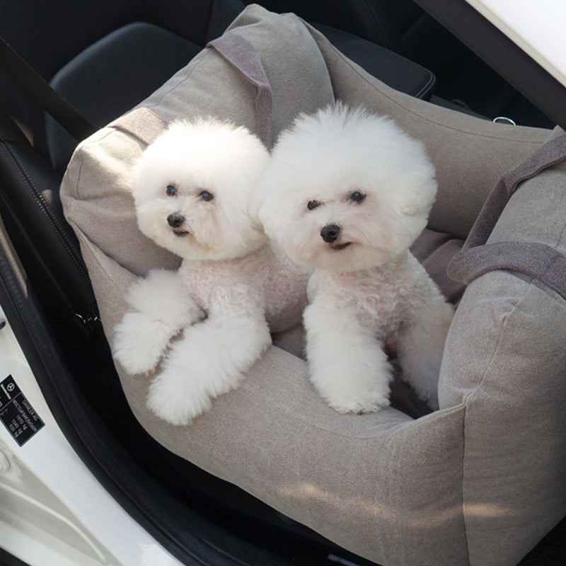 Pet Dog Car Carrier Seat Waterproof Basket in beige with two small white dogs seated inside, designed for safe and breathable pet travel.