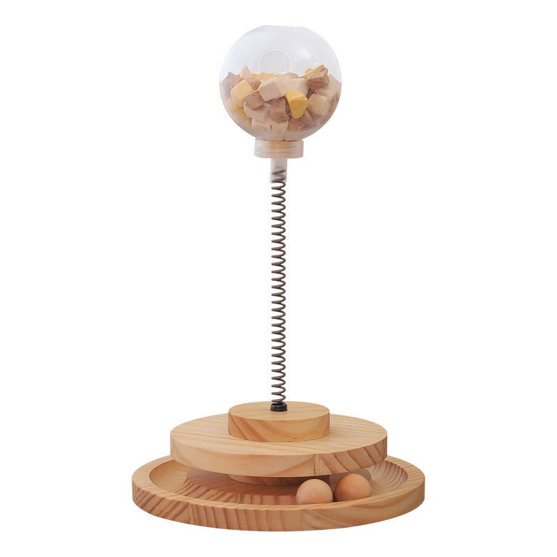 Cat Treats Dispenser Toy with spring-mounted clear ball filled with treats, wooden base, and interactive design for cats and small dogs.