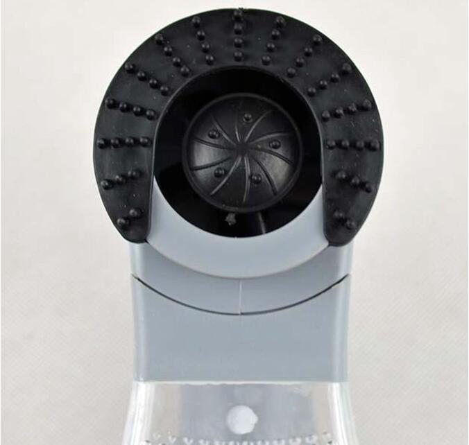 Electric pet hair remover device for cats and dogs with portable cordless design, shown in a modern living room with a golden retriever nearby.