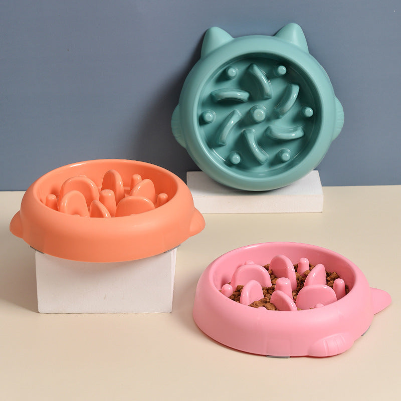 Pet Dog Cat Slow Feeder Bowls in pink, orange, and teal with anti-choking design for slow eating and bloat prevention at home.