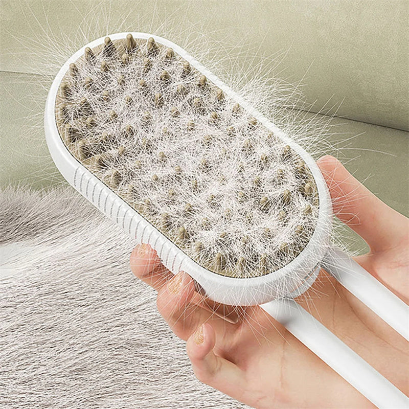 Cat Steam Brush Steamy Dog Brush 3 in 1 Electric Spray Cat Hair Brush shown grooming a gray tabby cat with massage and hair removal features.